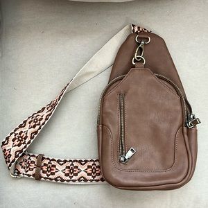 Altard state crossbody/sling bag. Color is brown.